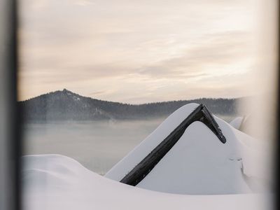 Silhouette of a person practicing breathing exercises at dawn.